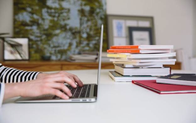 Woman typing in her laptop
