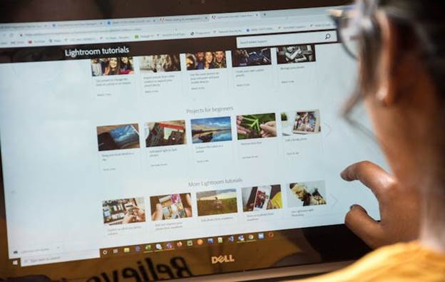 Woman browsing Lightroom tutorials