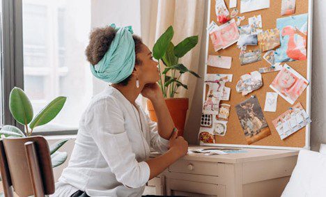 Woman looking at vision board