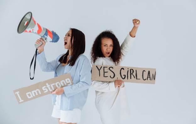 Women holding positive messages