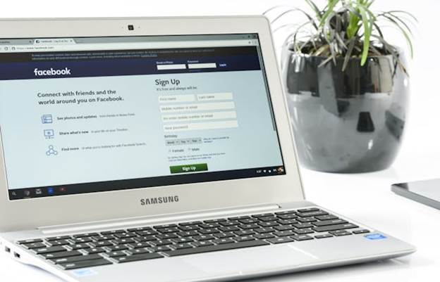 A laptop with the Facebook page open