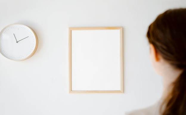 Women looking at the clock on the wall