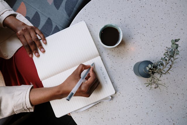 Woman writing on a notebook