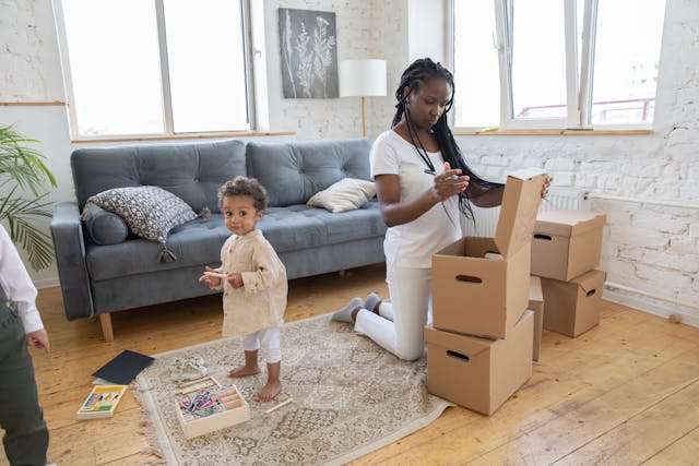 Mother organizing in boxes