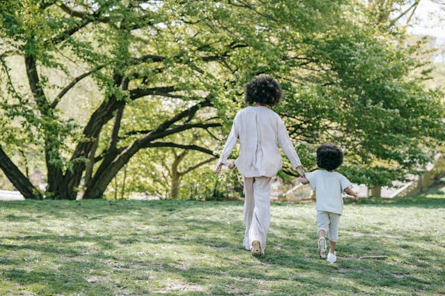 Mother and daughter going for a walk in the park