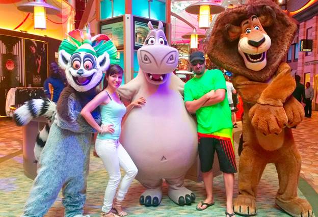 Melissa and husband posing with DreamWorks characters