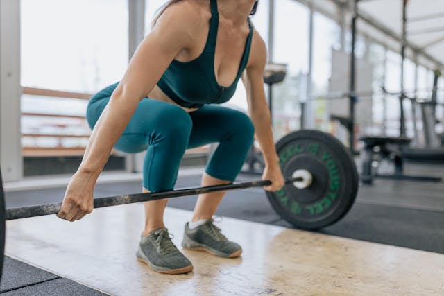 Woman weight lifting at the gym