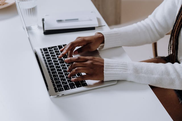 Woman typing in latop