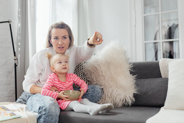 Mother and daughter watching television