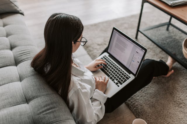 Woman typing in her laptop