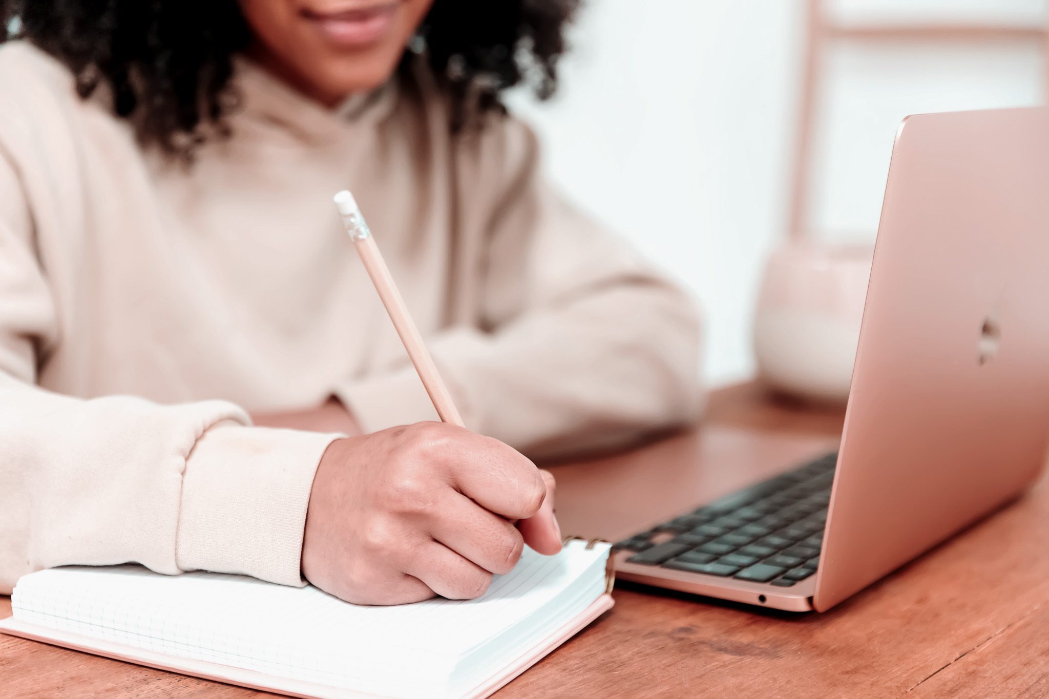 Woman writing in notebook