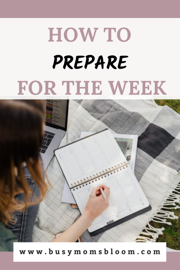 Woman writing in her weekly planner