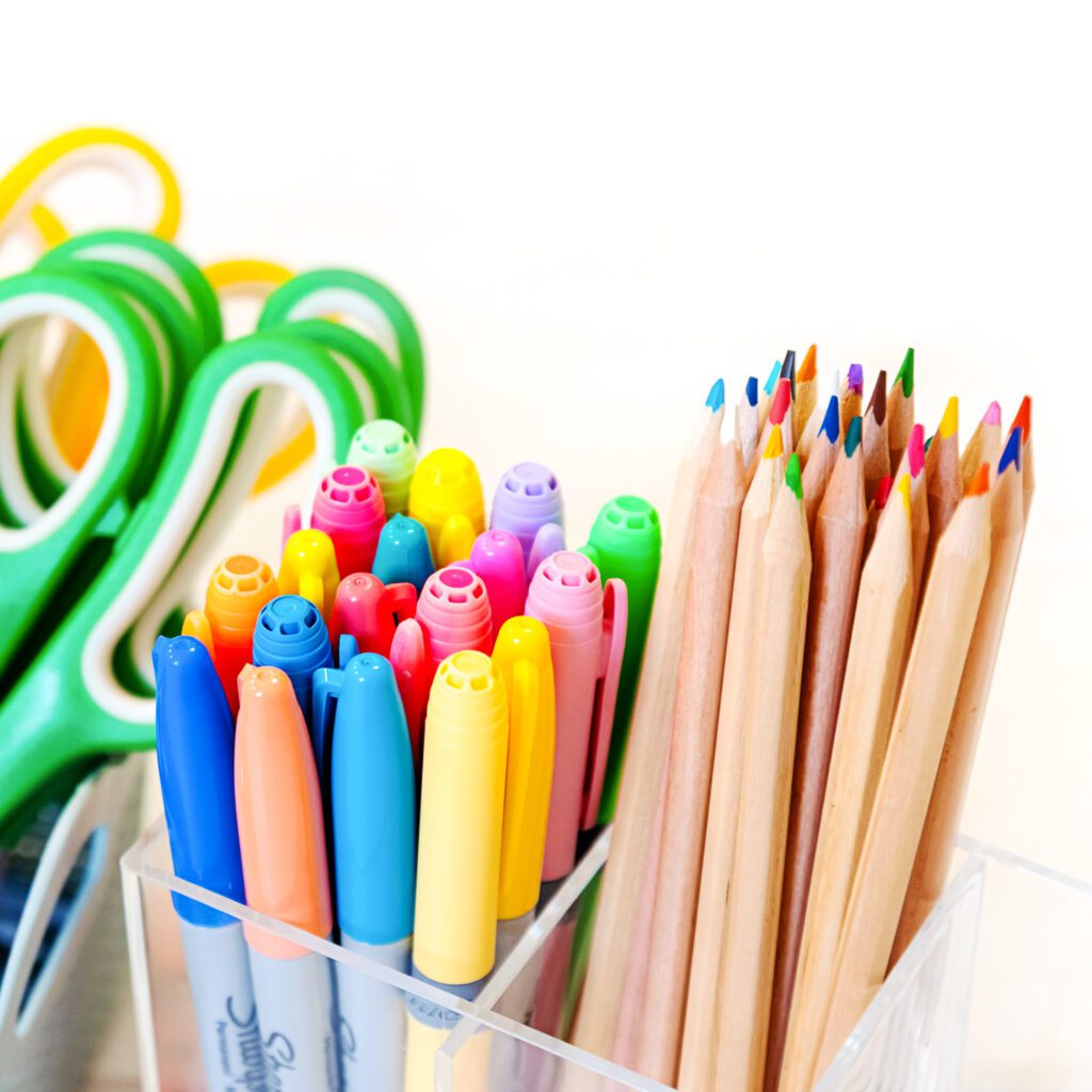 Highlighters, color pencils, and scissors