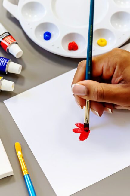 Female holding paint brush