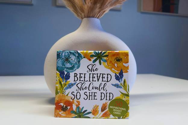 A box of positive quotes on a table