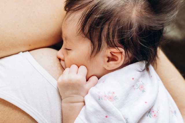 Mom breastfeeding baby