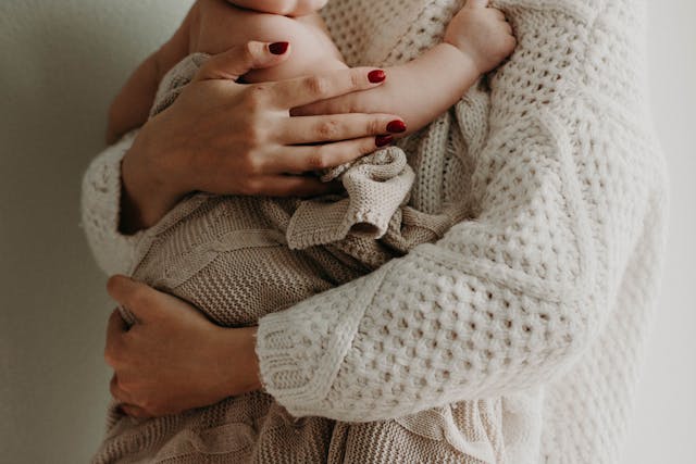 A mom holding her baby