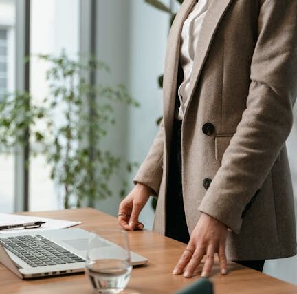 Copped woman wearing a blazer in her office