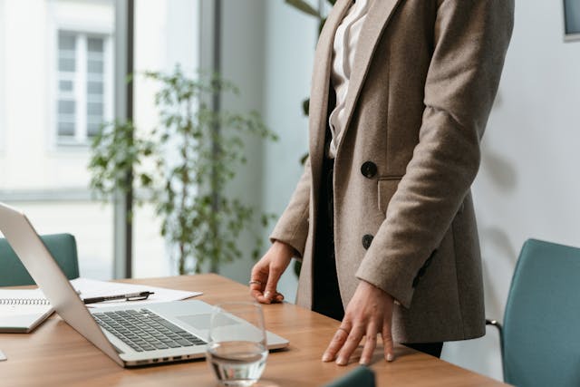 Copped woman wearing a blazer in her office