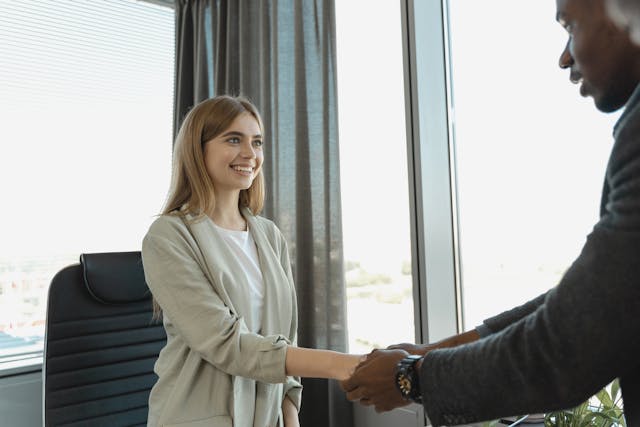 Woman shaking hands with the interviewer
