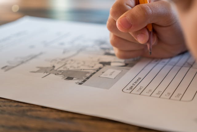 Child completing worksheet