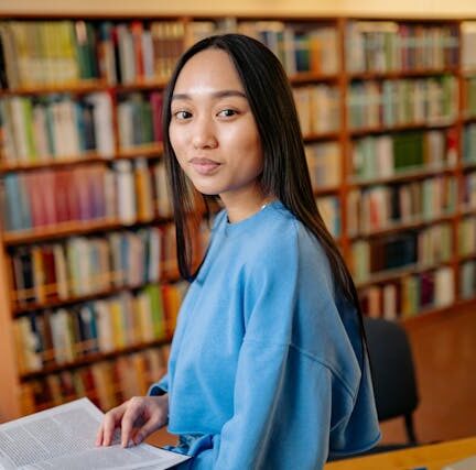 Teen girl smiling in the library