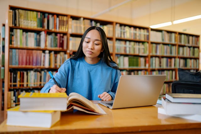 Teen girl studying in the library