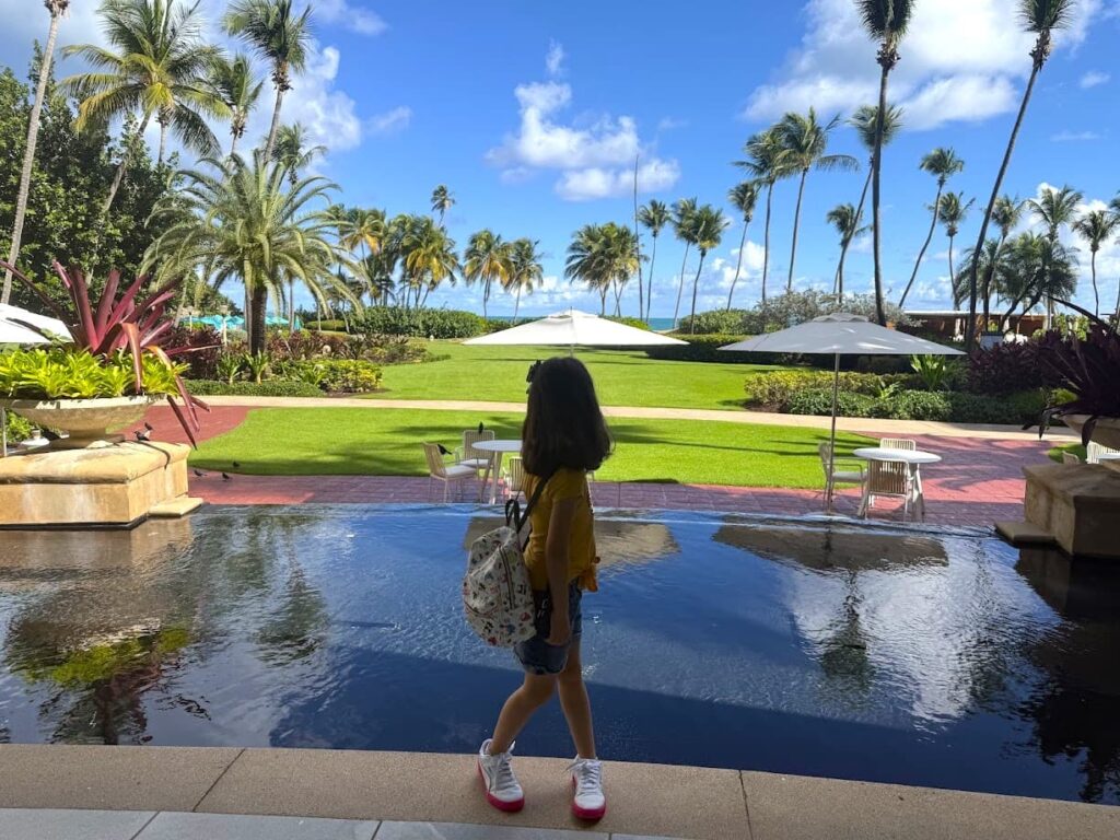 Melissa’s daughter enjoying the scenic view at the Wyndham Grand Rio Mar Hotel in Puerto Rico