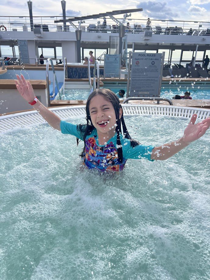 Melissas daughter enjoying the pool