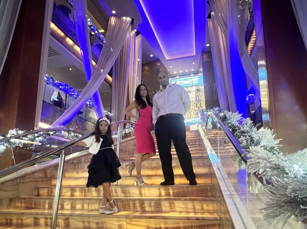 Melissas family posing on the cruise stairs