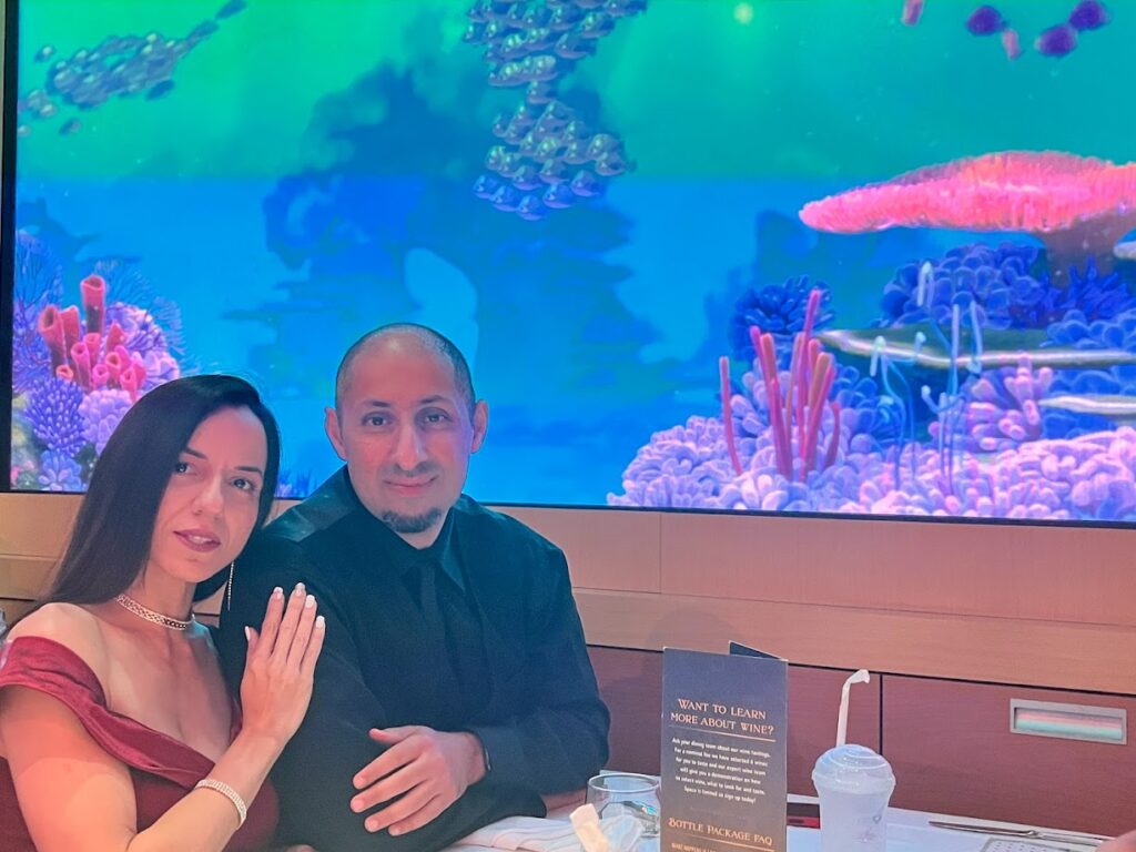 Melissa and husband in a Disney cruise restaurant