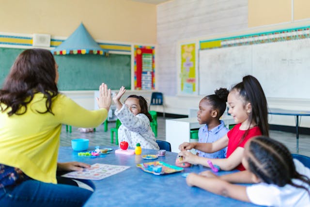 Teacher leading a small group lesson with students