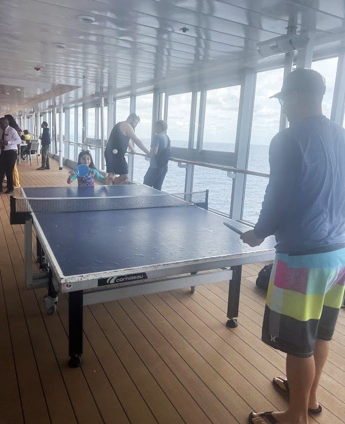 Melissas husband and daughter playing ping pong
