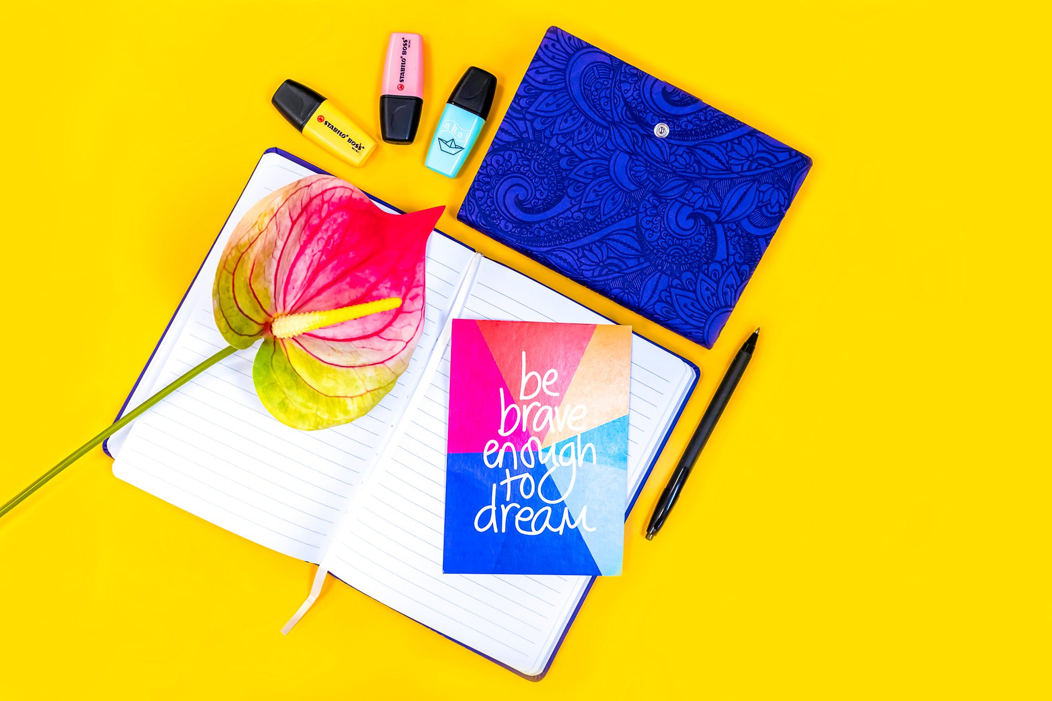 Motivational quote on a background, reading: "Be brave enough to dream"