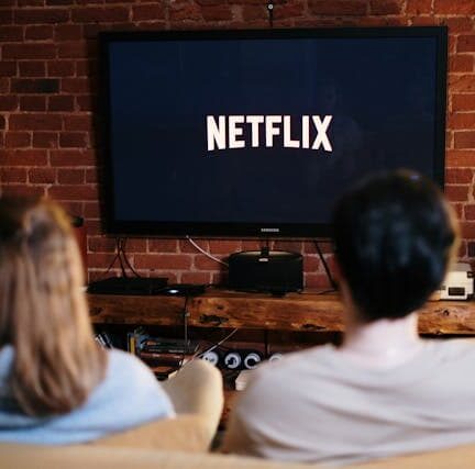 Man and woman watching Netflix