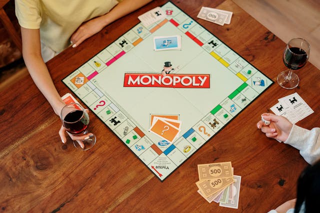 Two women playing Monopoly
