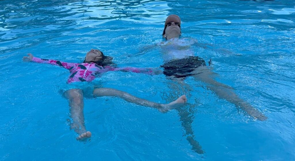 Sarah and Melissa in a pool