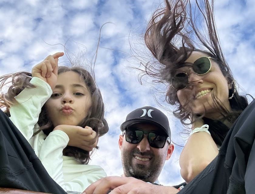 Family of three smiling