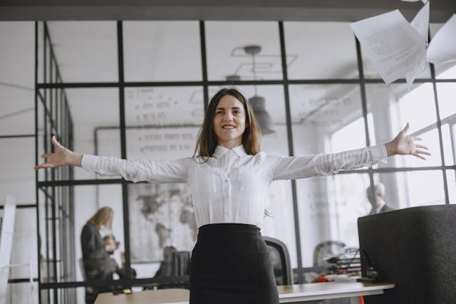 Woman expanding her arms in an office setting