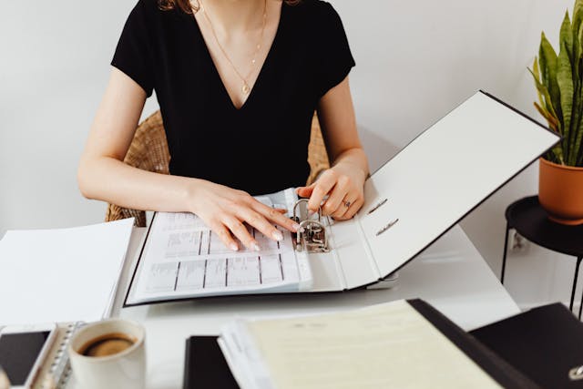 Woman using binder to organize herself