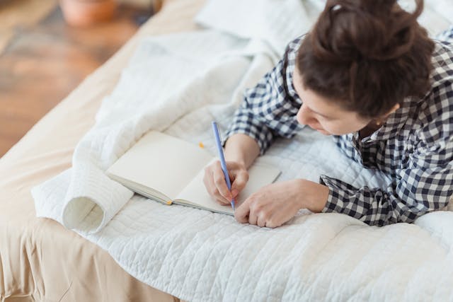 Woman writing in a journal