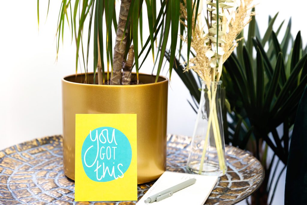A plant vase with a “You got this” quote on it