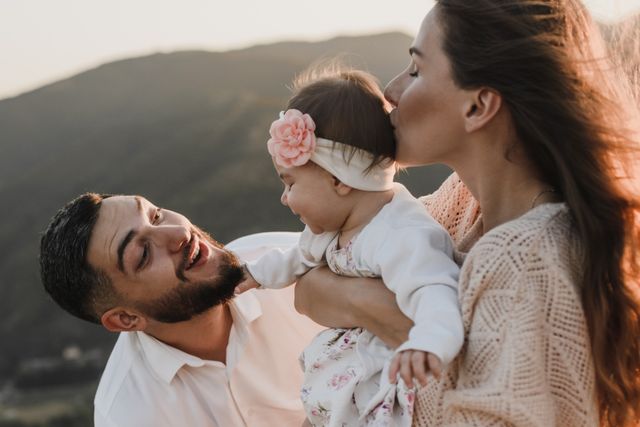 Parents and baby cuddling