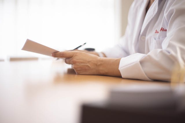 Close up of doctor holding medical record