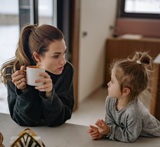 Mother talking with her daughter